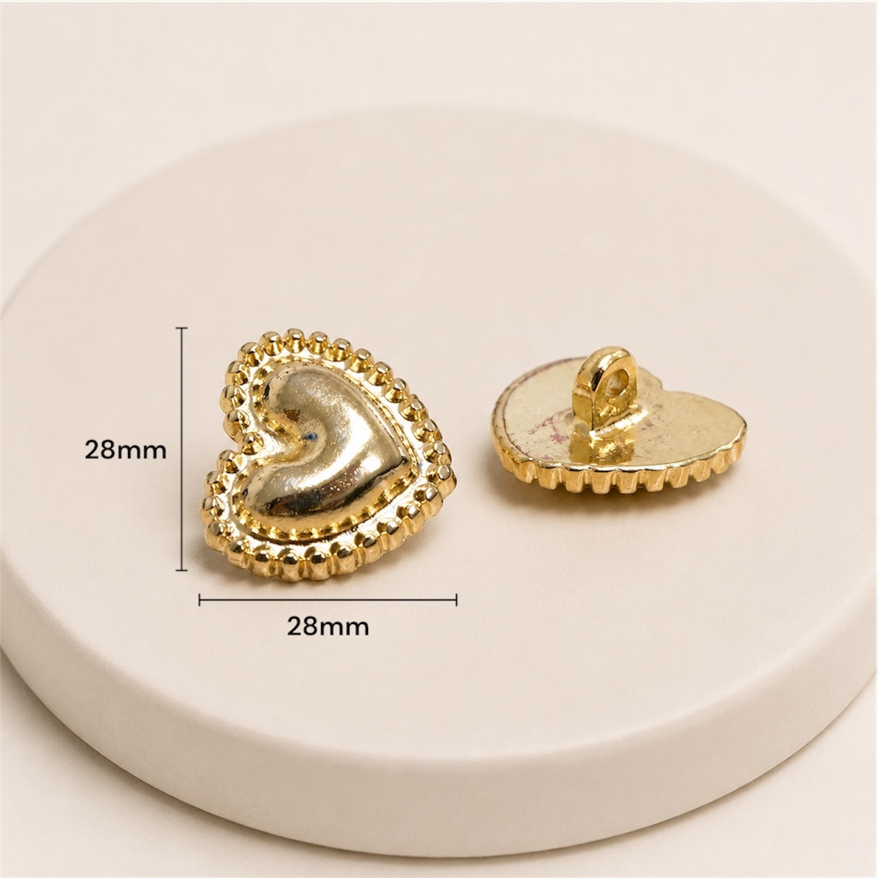 Botón Figura de Corazón Dorado